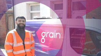 Engineer with van celebrating fastest install for Grain Full Fibre broadband